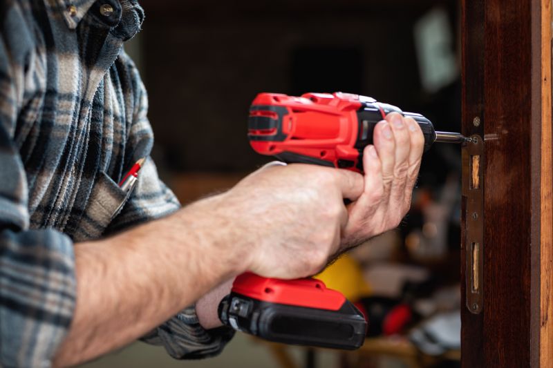 Professional restoring a front door